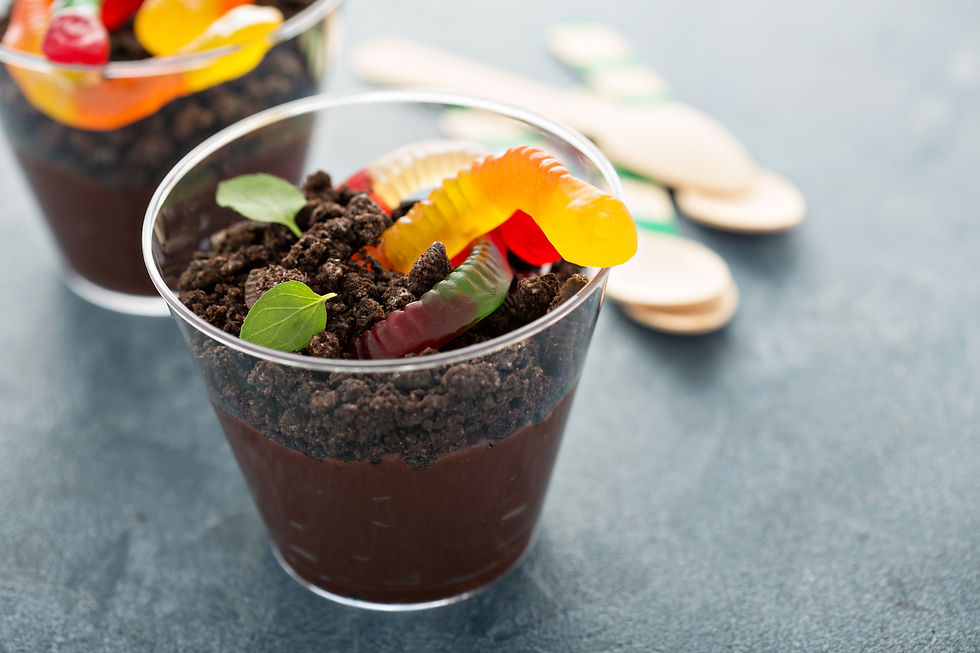 Chocolate dirt pudding cup with gummy worms and cookie crumbs