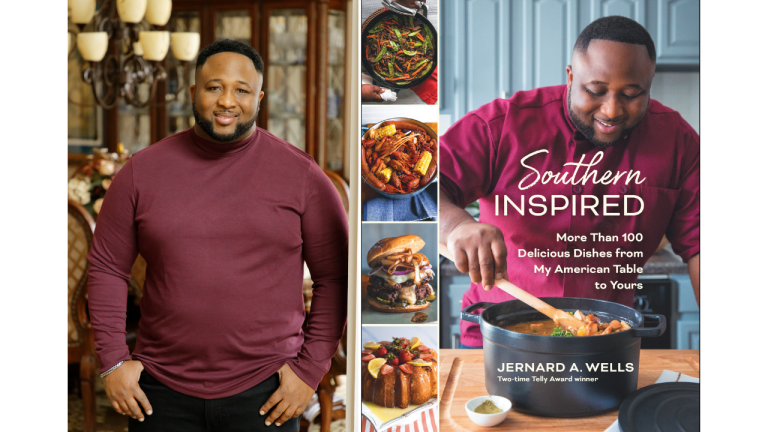 Jernard Wells poses with his cookbook, "Southern Inspired", showcasing delicious recipes.