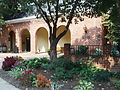 Exterior view of the Warrenton Library with brick facade and arched entrance.